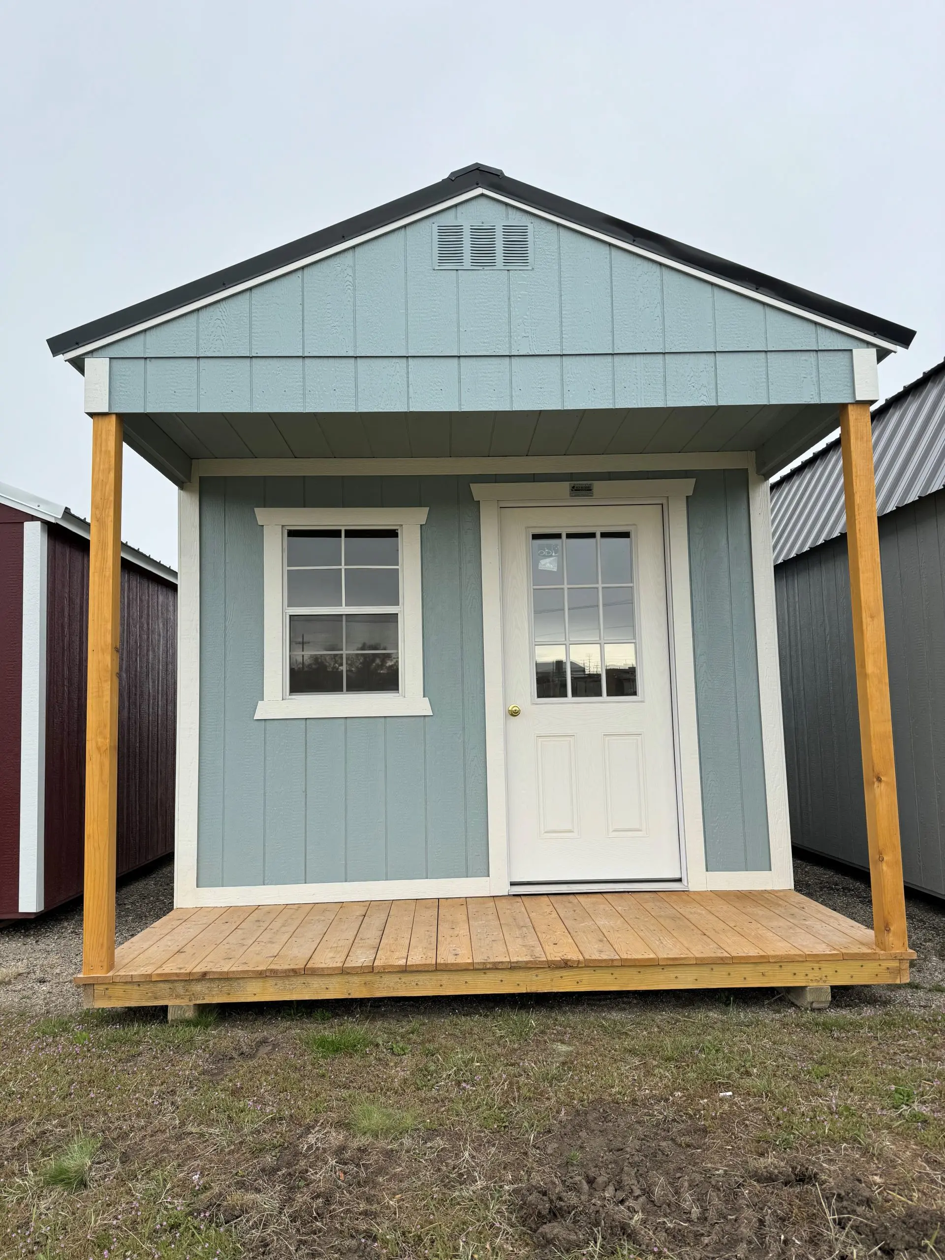 For sale 10×16 Utility Front Porch Shed Bora Bora Paint Barn White Trim at French Creek Design Shed Sales, Casper, WY