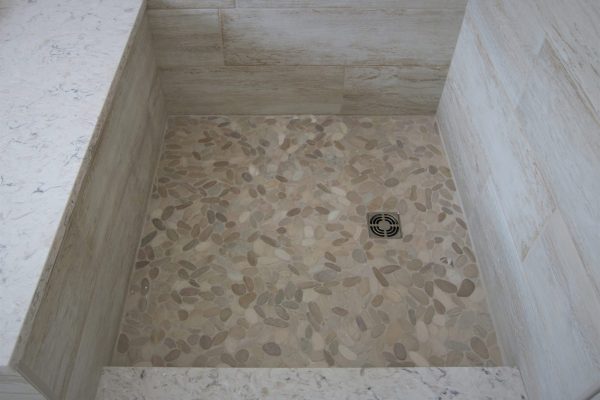 Client Bathroom Remodel 119 | sliced pebble tiles