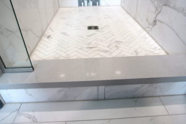 Client Bathroom Remodel 125, master bath shower design with waterfall, herringbone tile flooring, quartz bench