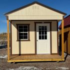 For Sale 10×20 Front Porch Shed For Sale Beige Paint Brown Trim at French Creek Designs Shed Sales