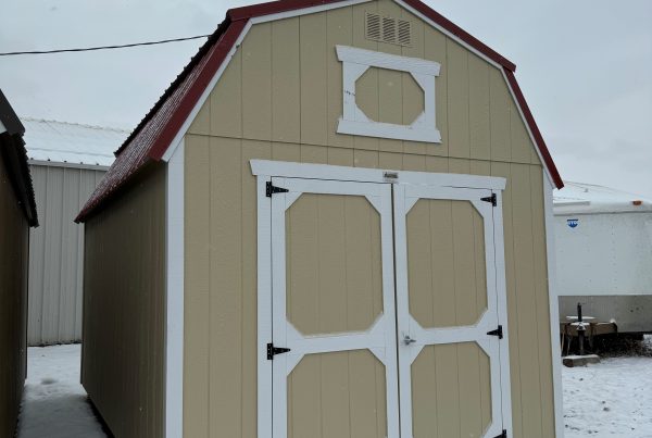 For Sale 10×16 Lofted Barn Shed For Sale Beige Paint Barn White Trim at French Creek Designs in Casper, WY