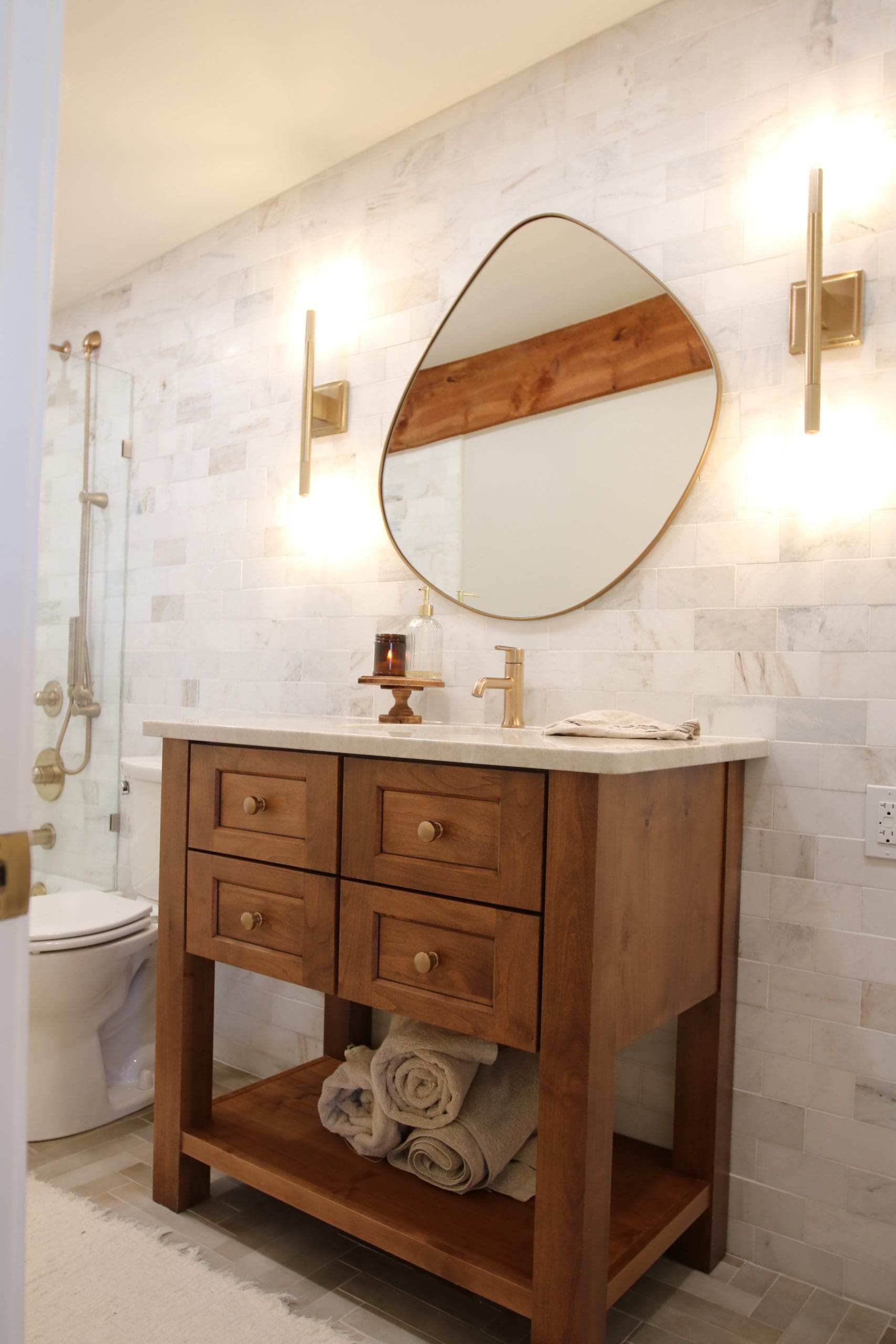 Client Bathroom Remodel 126 completed with French Creek Designs Vanity Cabinet, Marble Tiles, Vanity Sink, Quartz Countertops